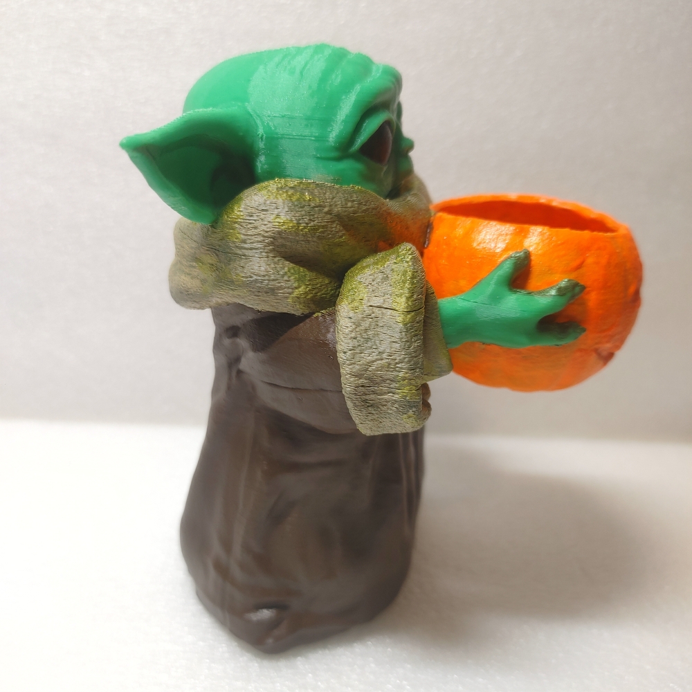 Green Baby Yoda Figurine Holding Orange Pumpkin - Picture 3 of 9